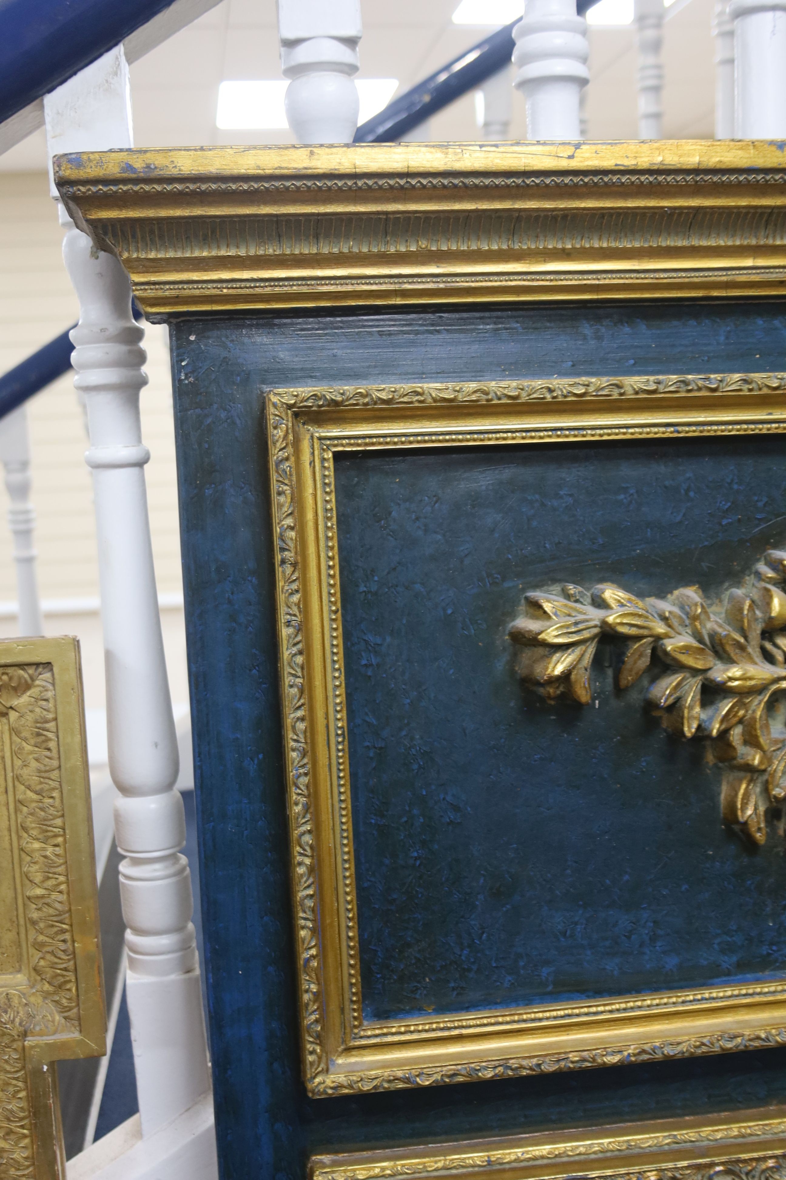 A 19th century French overmantel gilt and gesso mirror with musical themed emblem over on blue background, width 114cm, height 172cm